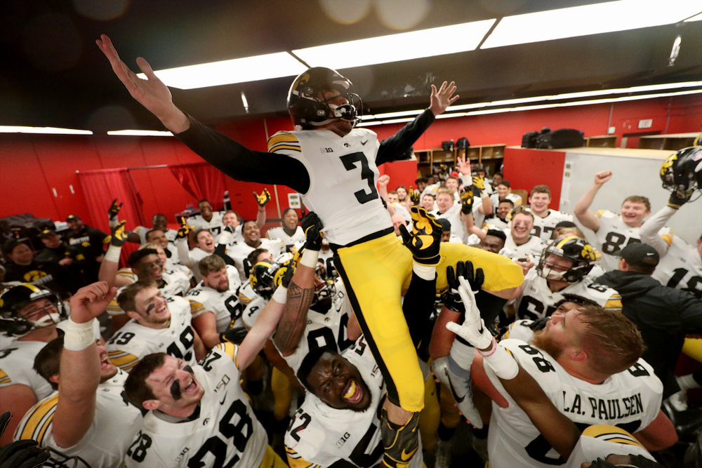 The Iowa Hawkeyes hoist up place kicker Keith Duncan (3) as they celebrate their victory against the Nebraska Cornhuskers Friday, November 29, 2019 at Memorial Stadium in Lincoln, Neb. (Brian Ray/hawkeyesports.com)