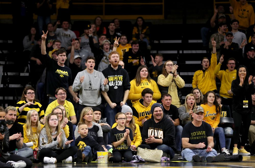 Fans cheer on IowaÕs Austin DeSanto as he wrestles WisconsinÕs Seth Gross at 133 pounds Sunday, December 1, 2019 at Carver-Hawkeye Arena. DeSanto won the match 6-2. (Brian Ray/hawkeyesports.com)