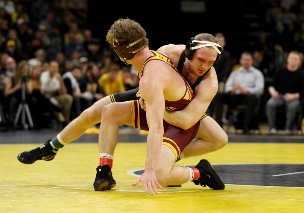 Iowa’s Kaleb Young wrestles Minnesota’s Ryan Thomas at 157 pounds Saturday, February 15, 2020 at Carver-Hawkeye Arena. Young won the match 5-4 in extra time. (Brian Ray/hawkeyesports.com)