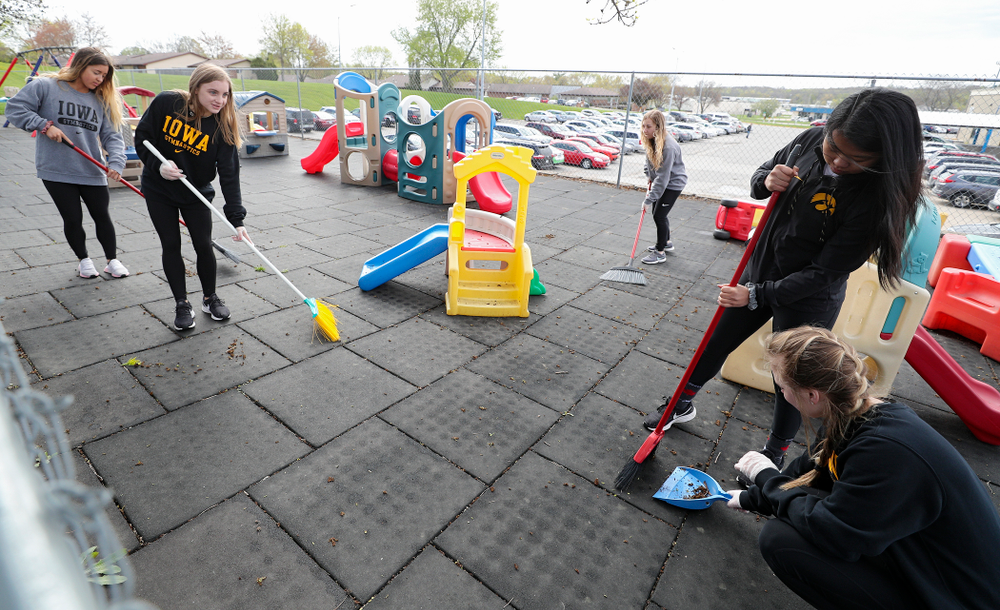 Iowa women's gymnasts clean outside Handicare during the 21st annual ISAAC Hawkeye Day of Caring in Coralville on Sunday, Apr. 28, 2019. (Stephen Mally/hawkeyesports.com)