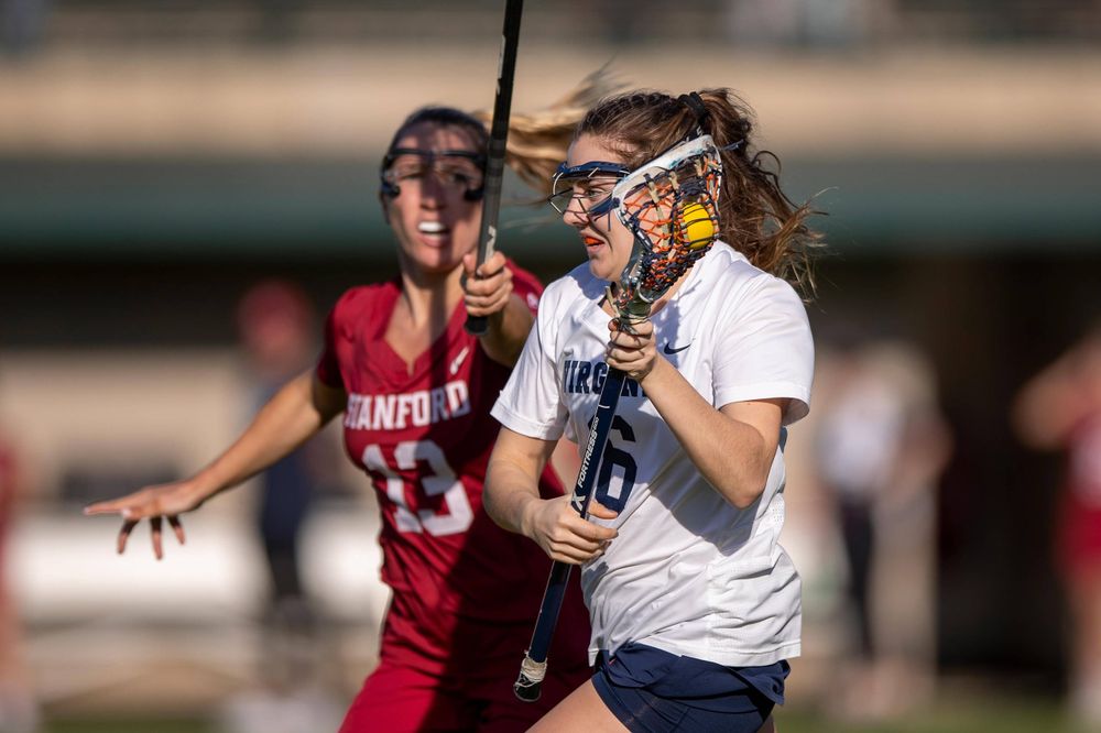 STANFORD, California - FEBRUARY 14: Virginia Cavaliers midfield/defense Gwin Sinnott (6) is defended by Stanford Cardinal attack Ali Baiocco (13) during the first half at Cagan Stadium on February 14, 2020 in Stanford, California. The Virginia Cavaliers defeated the Stanford Cardinal 12-11. (Photo by Jason O. Watson)