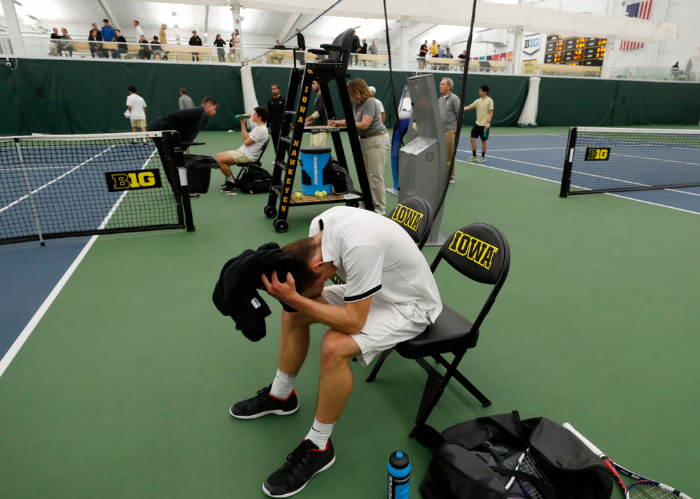 Iowa's Piotr Smietana celebrates with his teammates after clinching the match against Purdue Sunday, April 15, 2018 at the Hawkeye Tennis an