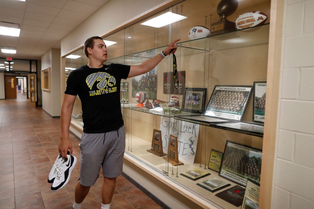 Iowa Hawkeyes quarterback Nathan Stanley (4) looks over the trophy case at his high school Wednesday, May 30, 2018 in Menomonie, Wisc. (Brian Ray/hawkeyesports.com)
