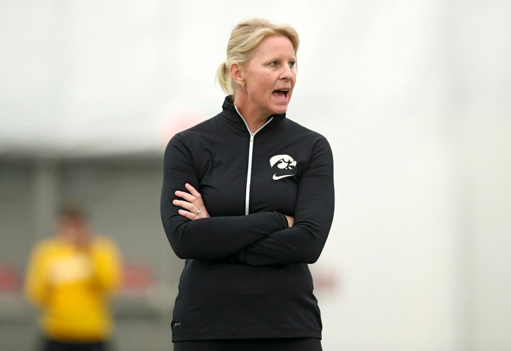 Iowa head coach Sasha Schmid shouts to her player during their match at the Hawkeye Tennis and Recreation Complex in Iowa City on Sunday, February 16, 2020. (Stephen Mally/hawkeyesports.com)