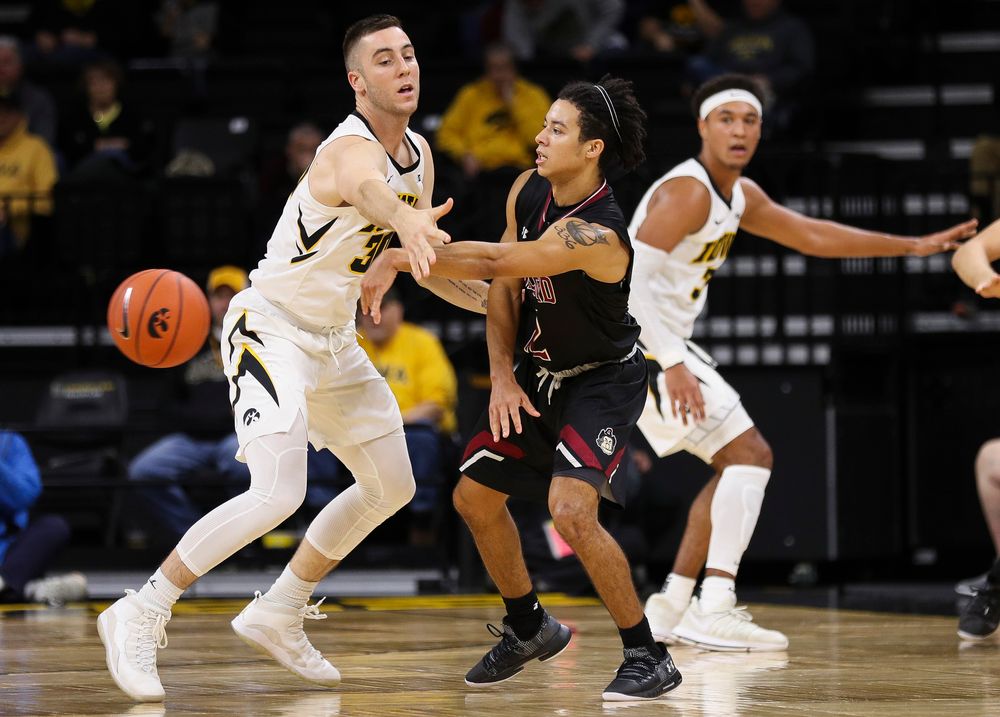 Iowa Hawkeyes guard Connor McCaffery (30) defends during a game against Guilford College at Carver-Hawkeye Arena on November 4, 2018. (Tork Mason/hawkeyesports.com)