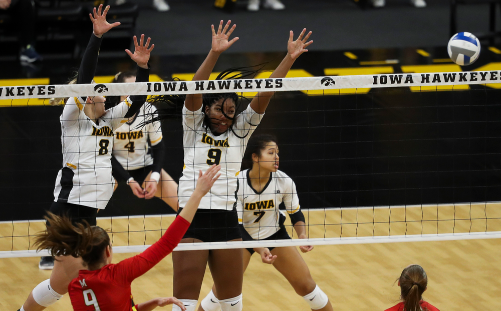 Iowa Hawkeyes right side hitter Reghan Coyle (8) and Iowa Hawkeyes middle blocker Amiya Jones (9) go up for a block during a match against Maryland at Carver-Hawkeye Arena on November 23, 2018. (Tork Mason/hawkeyesports.com)