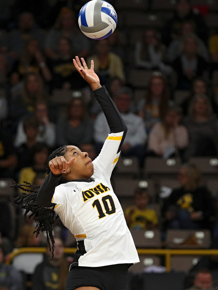 Iowa’s Griere Hughes (10) tips the ball over during the second set of their volleyball match at Carver-Hawkeye Arena in Iowa City on Sunday, Oct 13, 2019. (Stephen Mally/hawkeyesports.com)