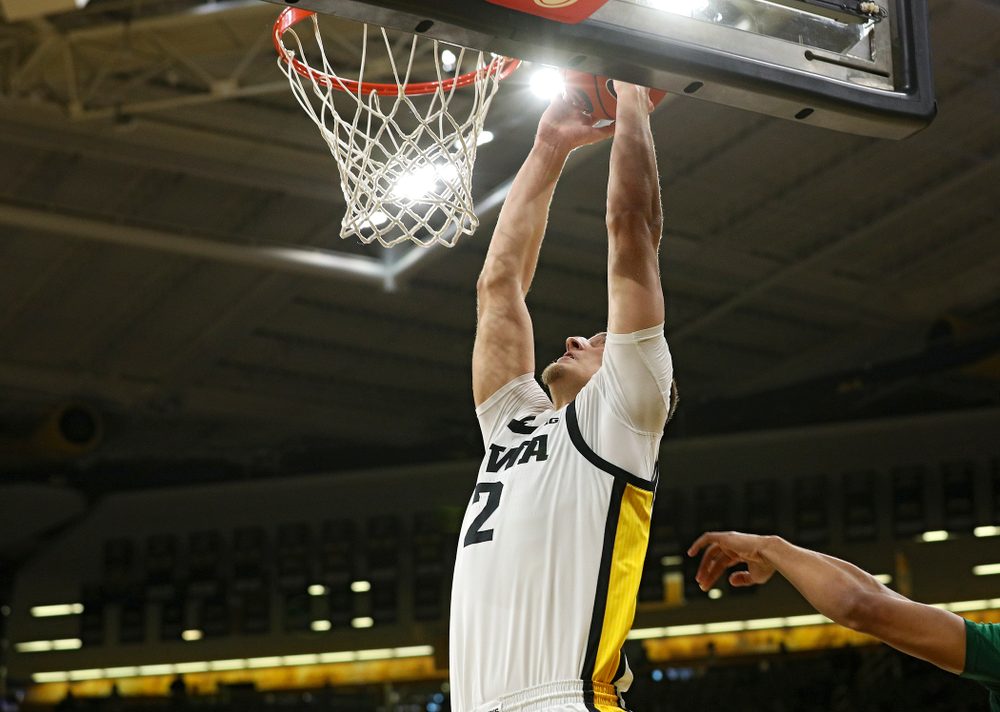 Iowa Hawkeyes forward Jack Nunge (2) dunks the ball during the first half of their game at Carver-Hawkeye Arena in Iowa City on Sunday, Nov 24, 2019. (Stephen Mally/hawkeyesports.com)