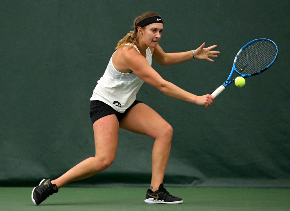 Iowa’s Ashleigh Jacobs returns a shot during her singles match at the Hawkeye Tennis and Recreation Complex in Iowa City on Sunday, February 23, 2020. (Stephen Mally/hawkeyesports.com)