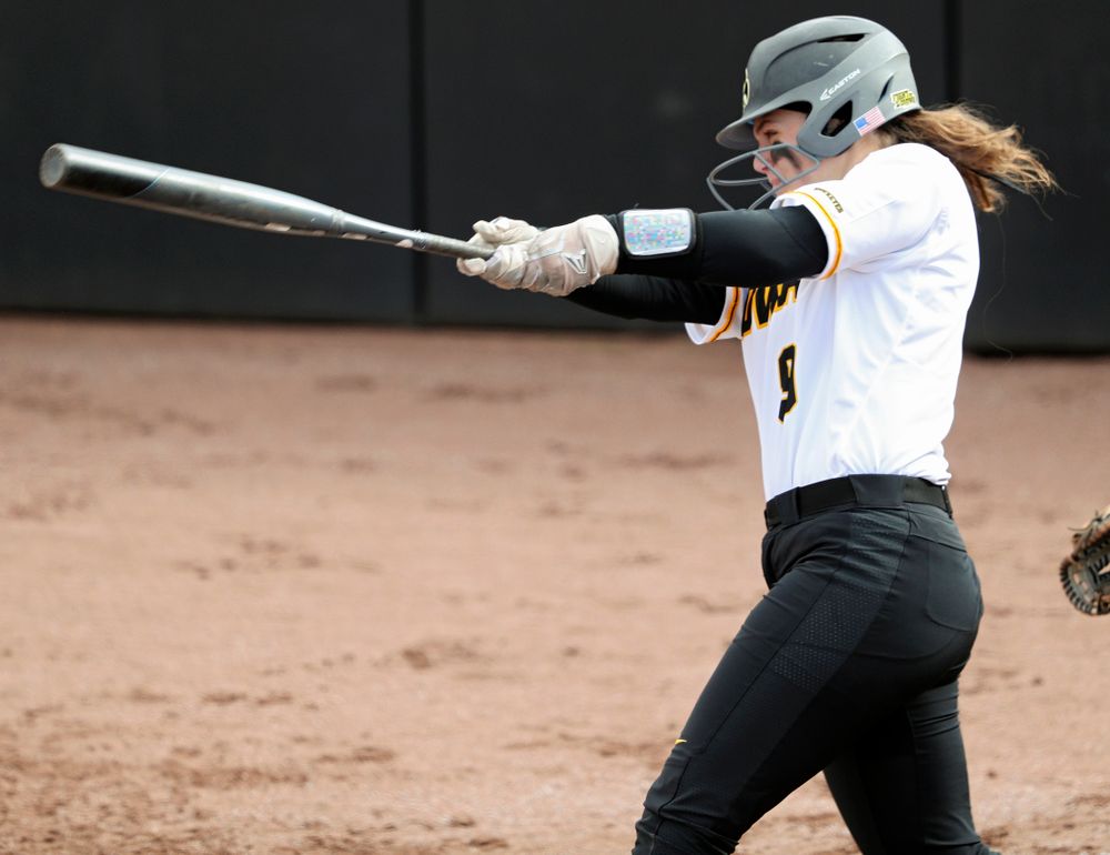 Iowa catcher Abby Lien (9) hits a home run during the second inning of their game against Illinois at Pearl Field in Iowa City on Friday, Apr. 12, 2019. (Stephen Mally/hawkeyesports.com)
