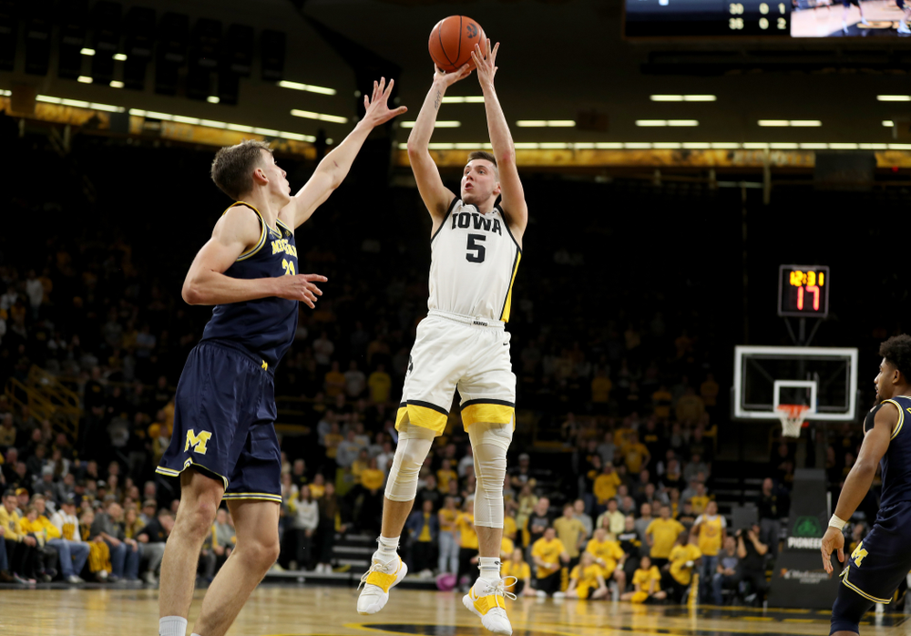 Iowa Hawkeyes guard CJ Fredrick (5) pulls up for a shot against the Michigan Wolverines Friday, January 17, 2020 at Carver-Hawkeye Arena. (Brian Ray/hawkeyesports.com)