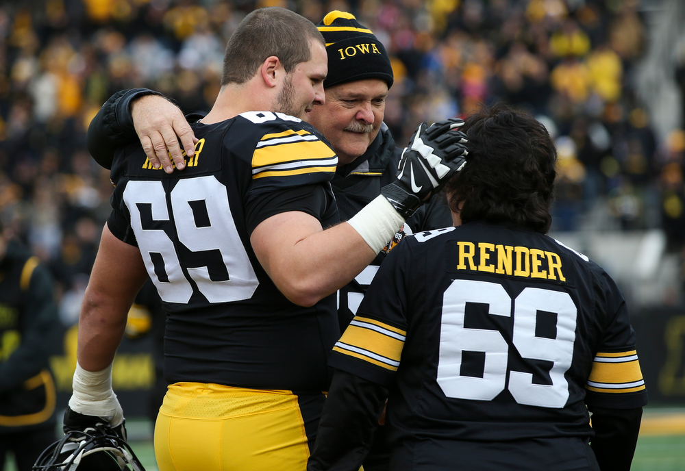 Iowa Hawkeyes offensive lineman Keegan Render (69) is greeted by his parents during Senior Day ceremonies before a game against Nebraska at Kinnick Stadium on November 23, 2018. (Tork Mason/hawkeyesports.com)