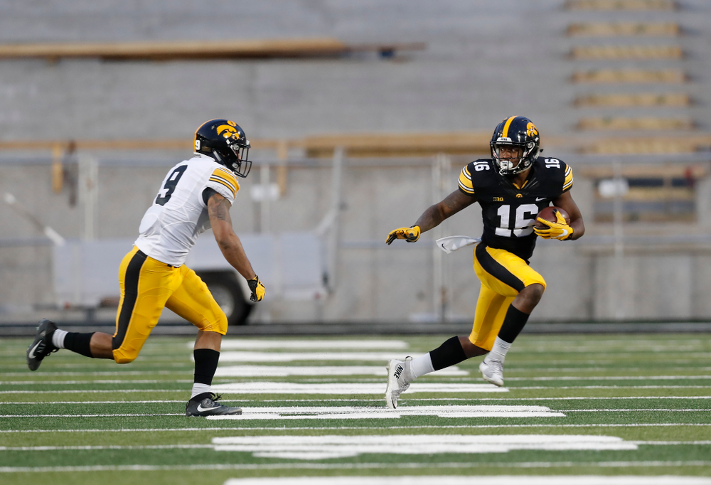 Iowa Hawkeyes running back Kyshaun Bryan (16) and defensive back Geno Stone (9) during the final spring practice Friday, April 20, 2018 at Kinnick Stadium. (Brian Ray/hawkeyesports.com)