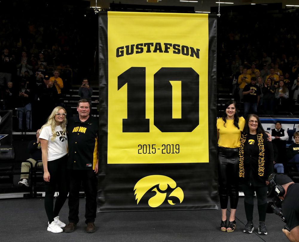 Megan Gustafson stands with her family as her number is raised into the rafters during a jersey retirement ceremony Sunday, January 26, 2020 at Carver-Hawkeye Arena. (Brian Ray/hawkeyesports.com)