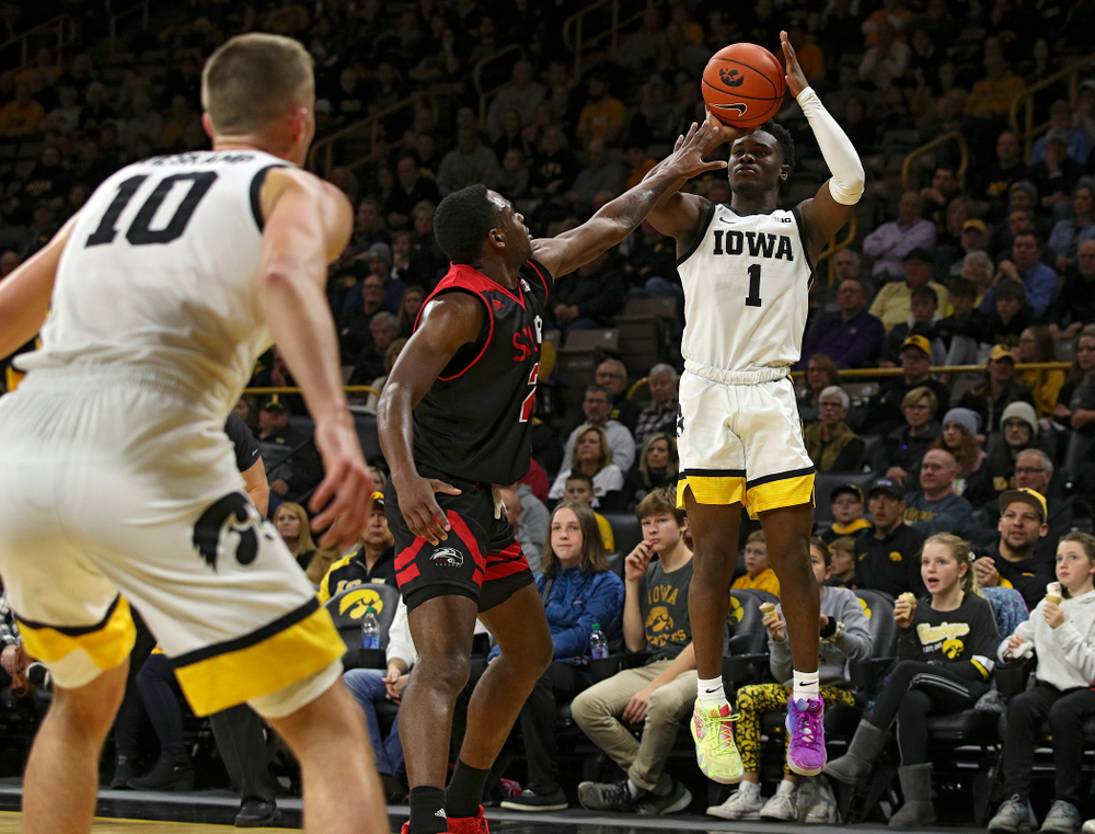 Iowa Hawkeyes guard Joe Toussaint (1) makes a 3-pointer during the first half of their game at Carver-Hawkeye Arena in Iowa City on Friday, Nov 8, 2019. (Stephen Mally/hawkeyesports.com)
