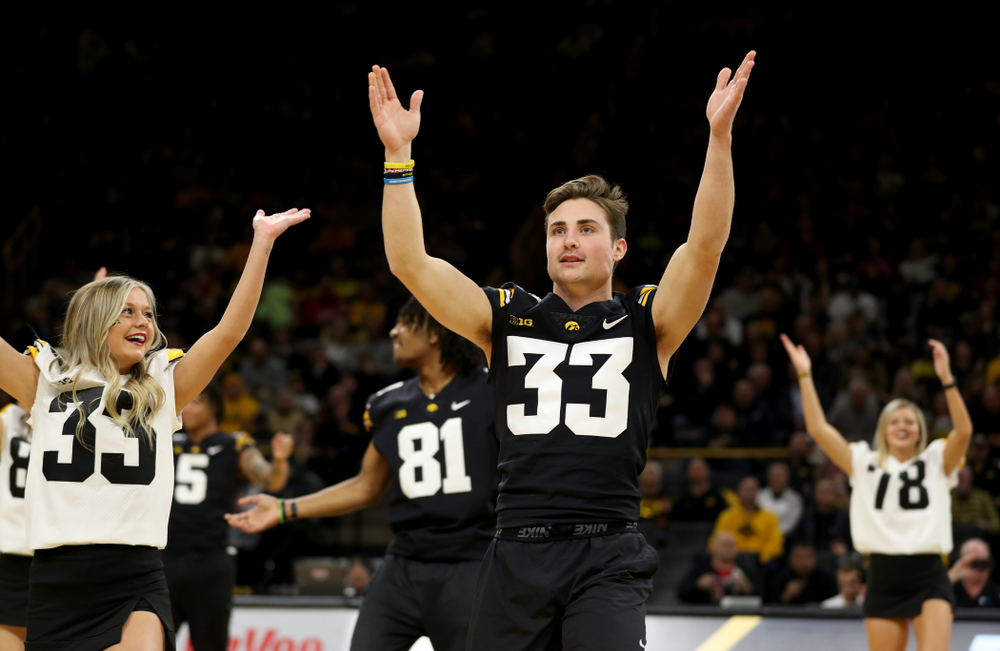 Members of the Hawkeye Football team performs with the Iowa Dance Team at halftime of the Iowa Hawkeyes game against the Ohio State Buckeyes Thursday, February 20, 2020 at Carver-Hawkeye Arena. (Brian Ray/hawkeyesports.com)