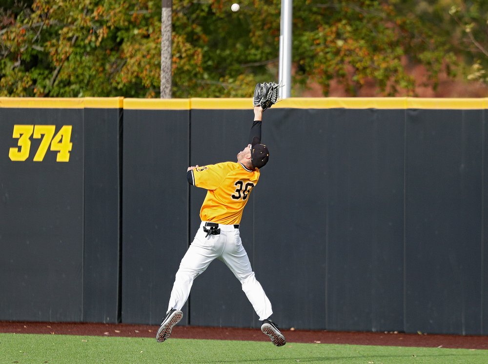 Iowa outfielder Connor McCaffery (30) makes a leaping catch on the run during the third inning of the first game of the Black and Gold Fall World Series at Duane Banks Field in Iowa City on Tuesday, Oct 15, 2019. (Stephen Mally/hawkeyesports.com)
