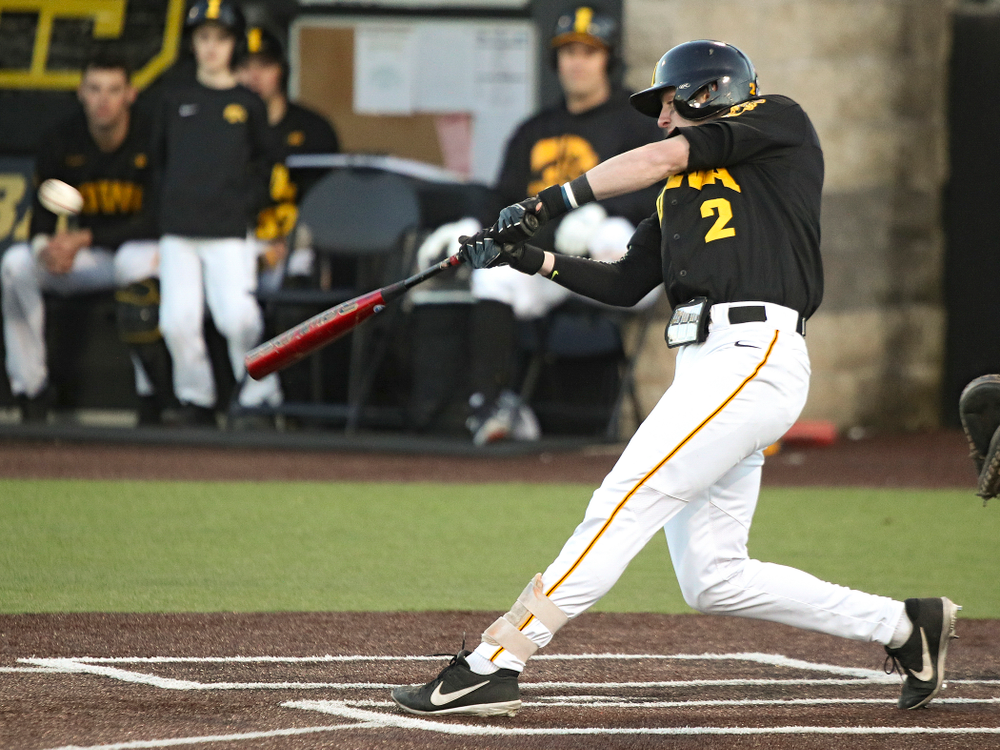 Iowa infielder Brendan Sher (2) drives a pitch for a hit during the fifth inning of their game at Duane Banks Field in Iowa City on Tuesday, March 3, 2020. (Stephen Mally/hawkeyesports.com)