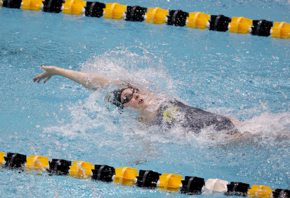 IowaÕs Emilia Sansome competes in the 100 yard backstroke against Notre Dame and Illinois Saturday, January 11, 2020 at the Campus Recreation and Wellness Center. (Brian Ray/hawkeyesports.com)