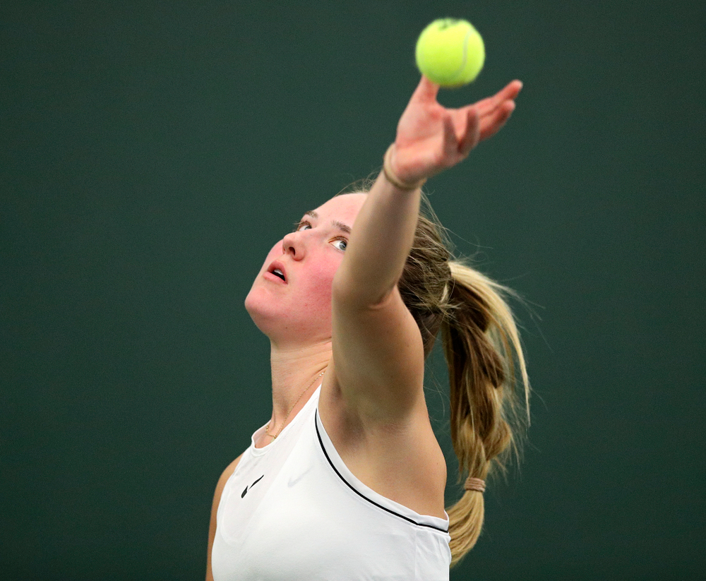 Iowa’s Danielle Burich serves during her singles match at the Hawkeye Tennis and Recreation Complex in Iowa City on Sunday, February 16, 2020. (Stephen Mally/hawkeyesports.com)