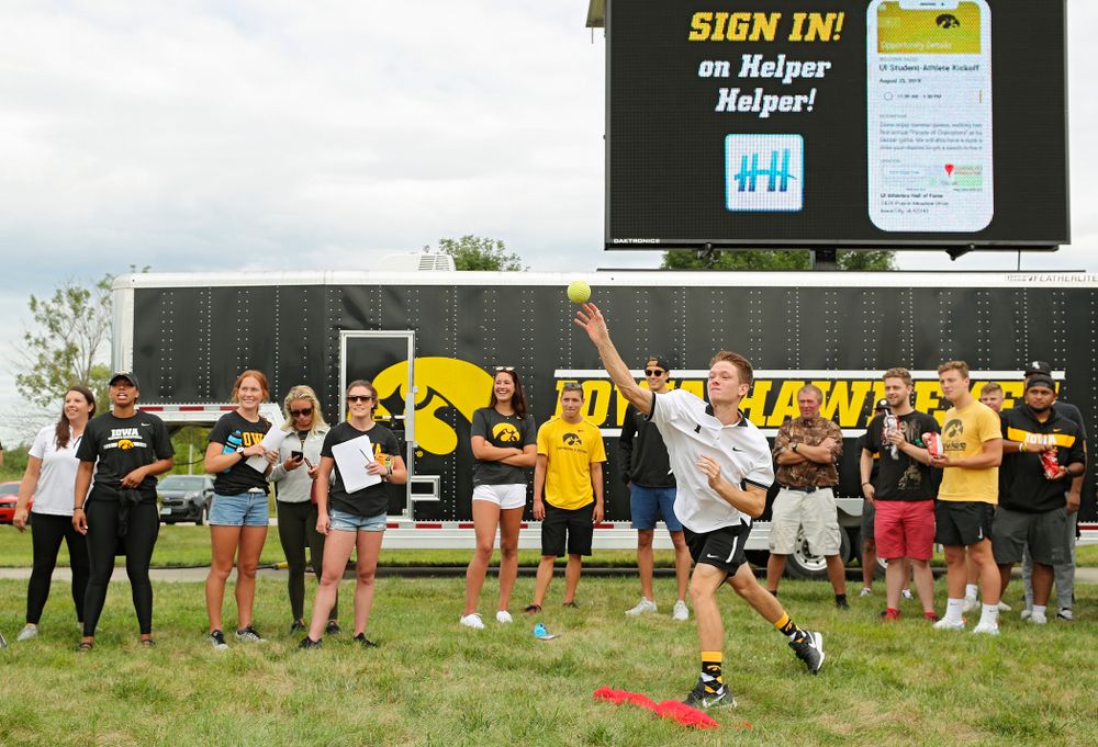 Iowa Men’s Tennis’ Jason Kerst tries to sink Swimming head coach Marc Long in the dunk tank during the Student-Athlete Kickoff outside the Karro Athletics Hall of Fame Building in Iowa City on Sunday, Aug 25, 2019. (Stephen Mally/hawkeyesports.com)