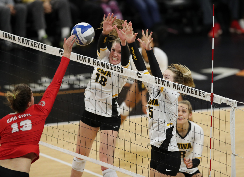 Iowa Hawkeyes middle blocker Hannah Clayton (18) and outside hitter Meghan Buzzerio (5) against the Ohio State Buckeyes Saturday, November 24, 2018 at Carver-Hawkeye Arena. (Brian Ray/hawkeyesports.com)
