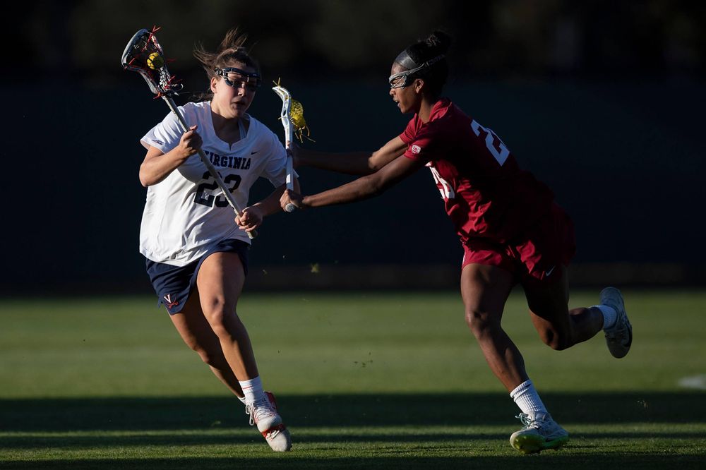 STANFORD, California - FEBRUARY 14: Virginia Cavaliers midfield Kiki Shaw (23) is defended by Stanford Cardinal midfield Mikaela Watson (26) during the second half at Cagan Stadium on February 14, 2020 in Stanford, California. The Virginia Cavaliers defeated the Stanford Cardinal 12-11. (Photo by Jason O. Watson)