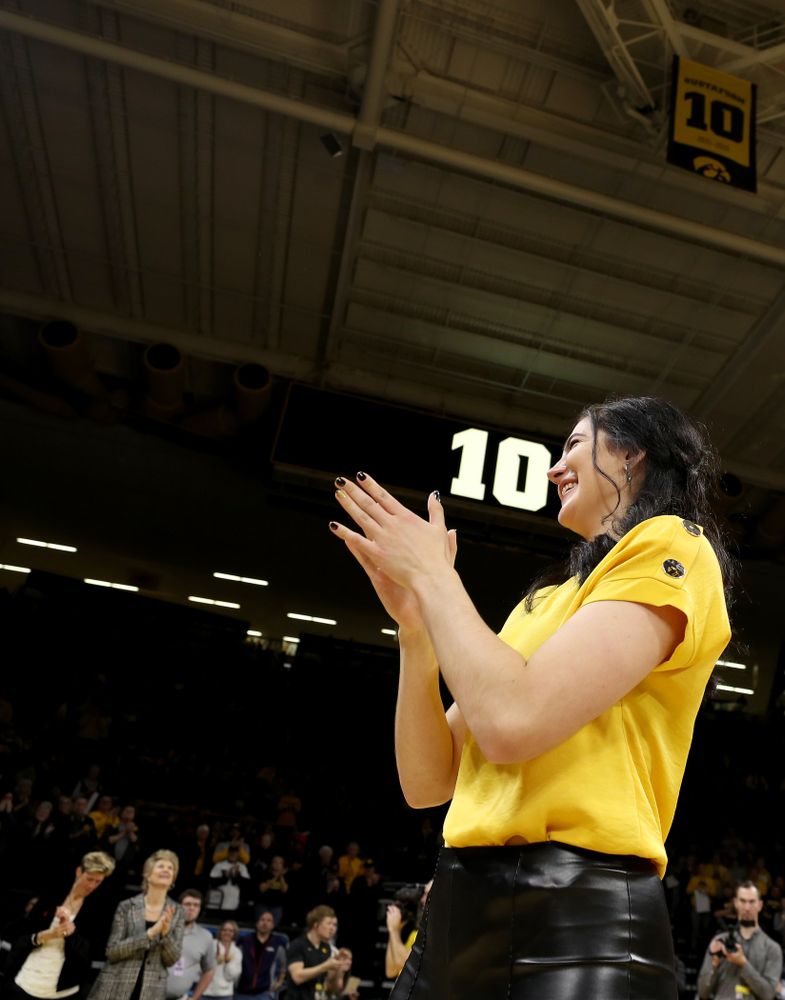 Megan Gustafson waves to the fans after her number was raised into the rafters during a jersey retirement ceremony Sunday, January 26, 2020 at Carver-Hawkeye Arena. (Brian Ray/hawkeyesports.com)