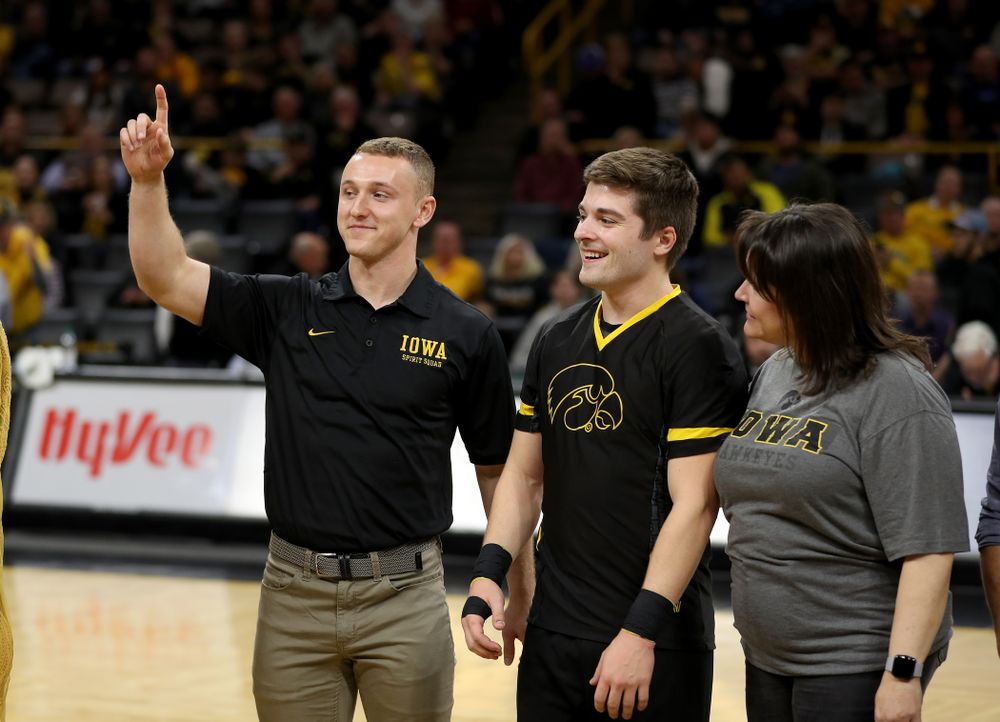 The Iowa Cheerleaders and Dance Team perform on senior night at half-time of the Iowa Hawkeyes game against the Purdue Boilermakers Tuesday, March 3, 2020 at Carver-Hawkeye Arena. (Brian Ray/hawkeyesports.com)