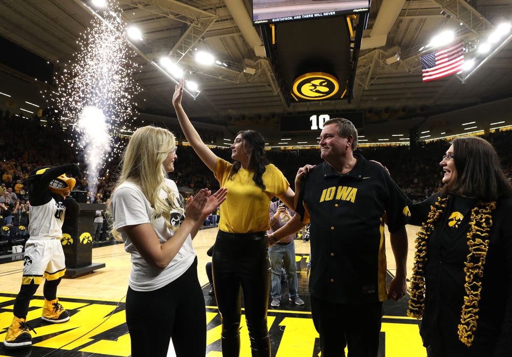 Megan Gustafson waves to the fans as her number is raised into the rafters during a jersey retirement ceremony Sunday, January 26, 2020 at Carver-Hawkeye Arena. (Brian Ray/hawkeyesports.com)