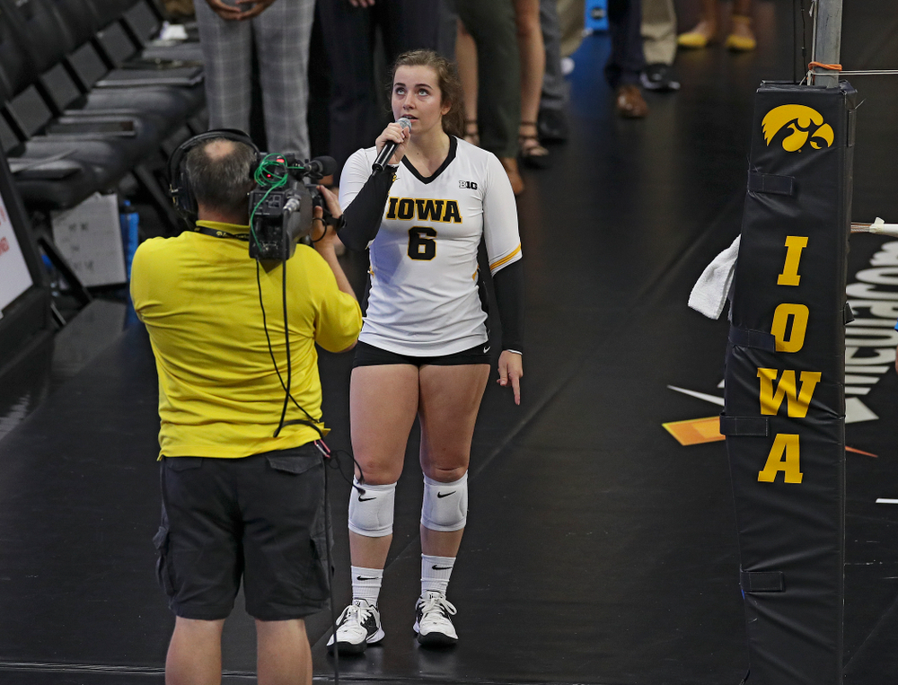 Iowa’s Emma Lowes (6) sings the National Anthem before their Big Ten/Pac-12 Challenge match against Colorado at Carver-Hawkeye Arena in Iowa City on Friday, Sep 6, 2019. (Stephen Mally/hawkeyesports.com)