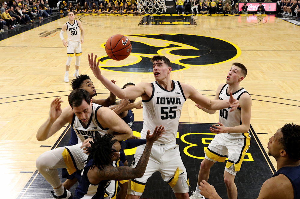 Iowa Hawkeyes forward Luka Garza (55) grabs a rebound against Penn State Saturday, February 29, 2020 at Carver-Hawkeye Arena. (Brian Ray/hawkeyesports.com)