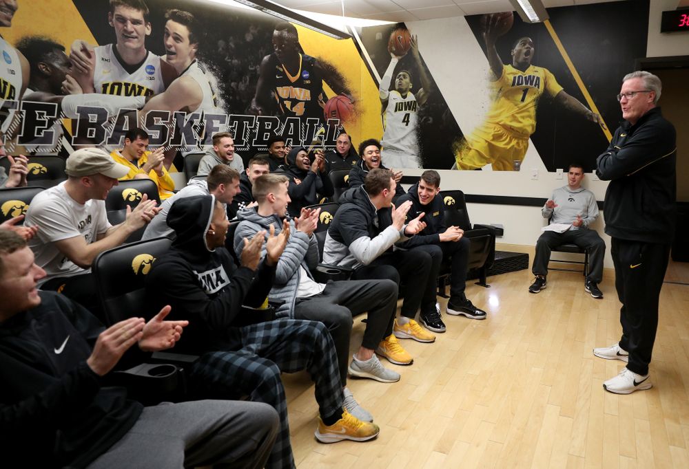 The Iowa Hawkeyes congratulate forward Luka Garza (55) after finding out that he has been named the Big Ten Player of the Year Monday, March 9, 2020 at Carver-Hawkeye Arena. (Brian Ray/hawkeyesports.com)