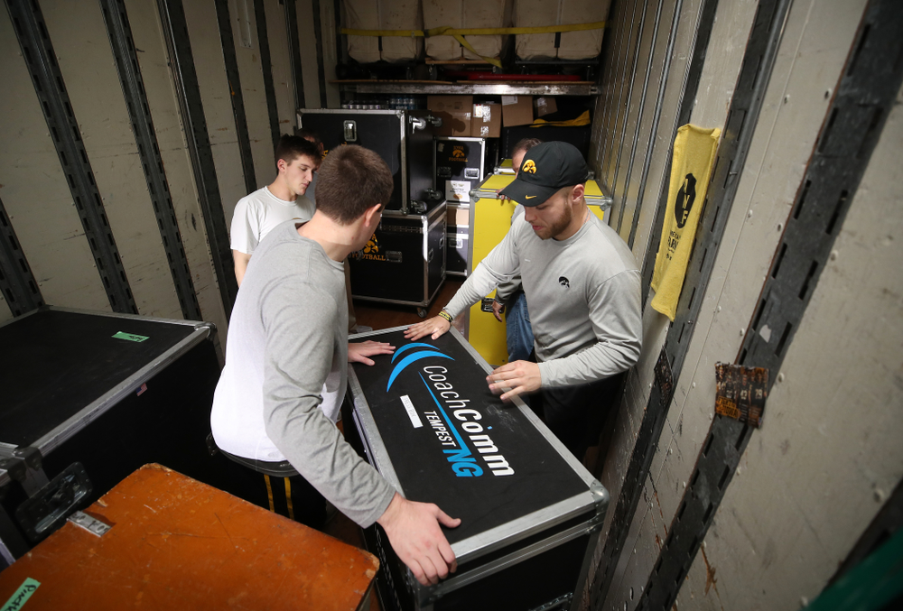 Members fo the Hawkeye Football equipment staff and managers load equipment onto the truck bound for Tampa for the Outback Bowl Wednesday, December 19, 2018 at the Hansen Football Performance Center. (Brian Ray/hawkeyesports.com)