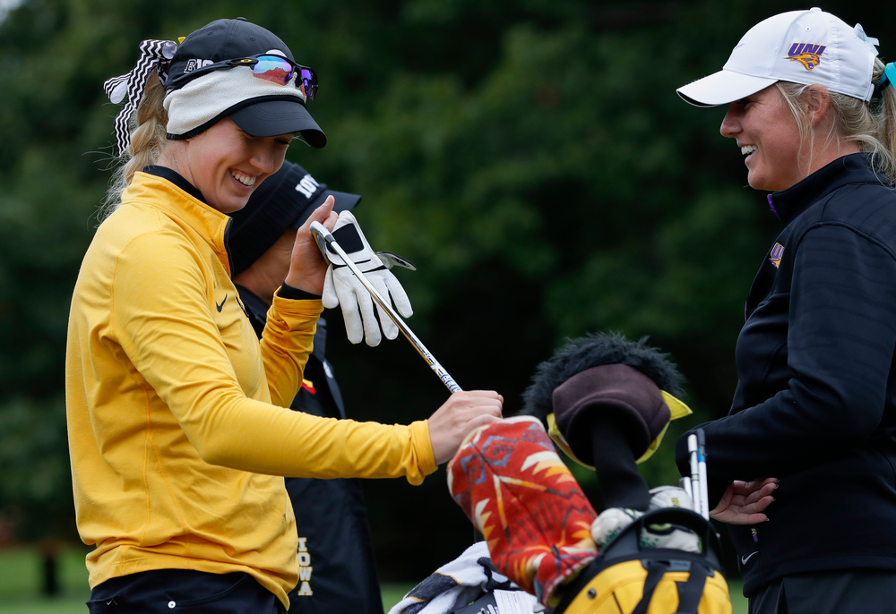 Iowa's Shawn Rennegarbe shares a laugh with former teammate and current Northern Iowa assistant coach Jessie Sindlinger at the eighth tee during the Diane Thomason Invitational at Finkbine Golf Course on September 29, 2018. (Tork Mason/hawkeyesports.com)