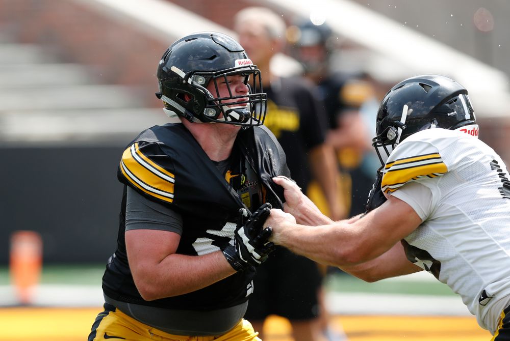 Iowa Hawkeyes offensive lineman Matt Fagan (54) and linebacker Mike Timm (19) during Kids Day Saturday, August 11, 2018 at Kinnick Stadium. (Brian Ray/hawkeyesports.com)