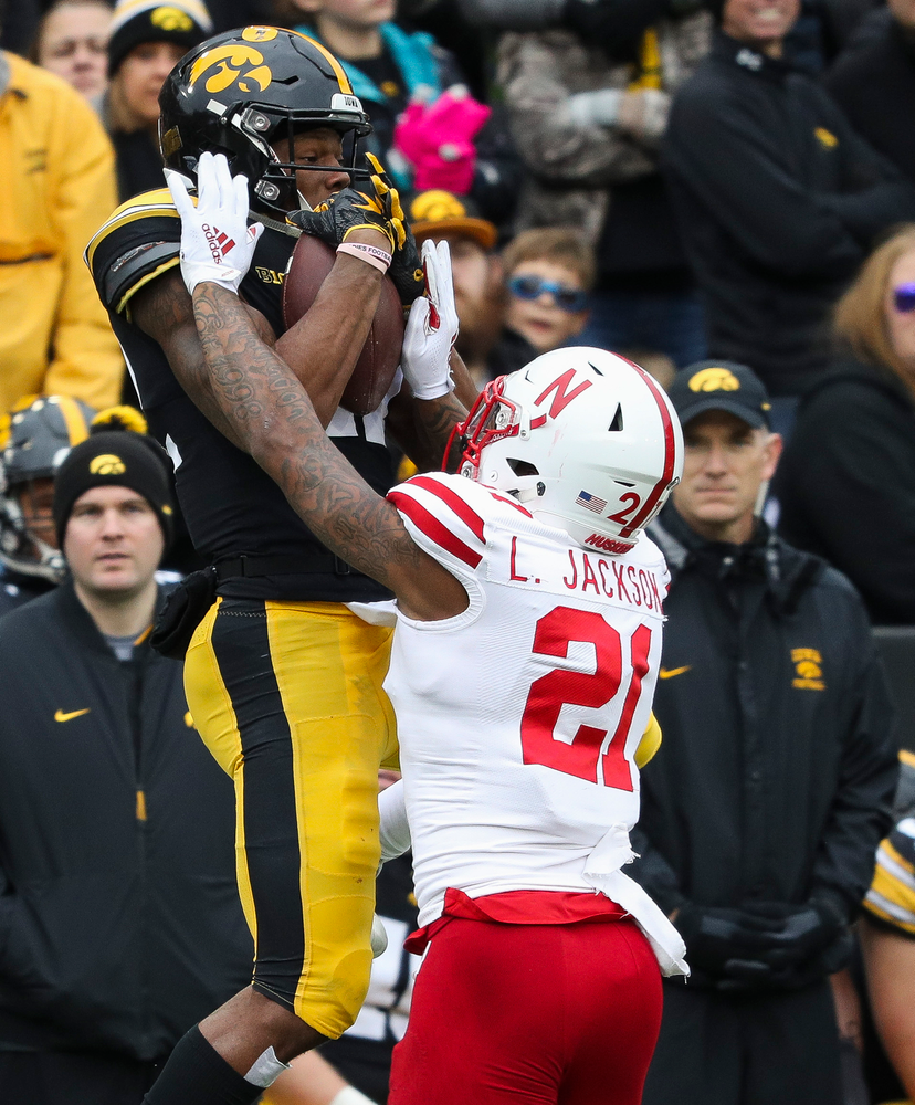 Iowa Hawkeyes wide receiver Brandon Smith (12) makes a first down reception during a game against Nebraska at Kinnick Stadium on November 23, 2018. (Tork Mason/hawkeyesports.com)