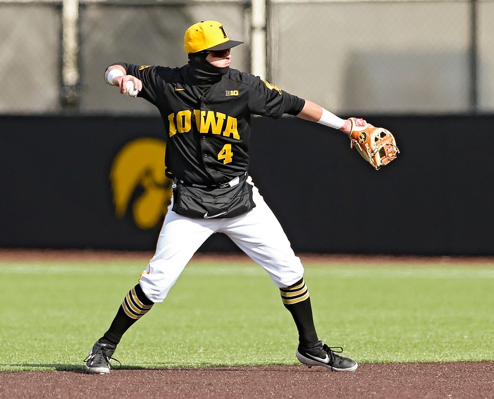 Iowa Hawkeyes second baseman Mitchell Boe (4) throws to first for an out during the seventh inning of their game against Illinois at Duane Banks Field in Iowa City on Saturday, Mar. 30, 2019. (Stephen Mally/hawkeyesports.com)