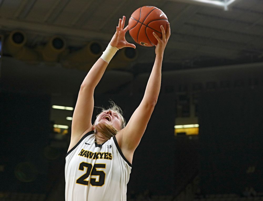 Iowa Hawkeyes forward Monika Czinano (25) grabs a ball during the second quarter of their game at Carver-Hawkeye Arena in Iowa City on Sunday, January 12, 2020. (Stephen Mally/hawkeyesports.com)