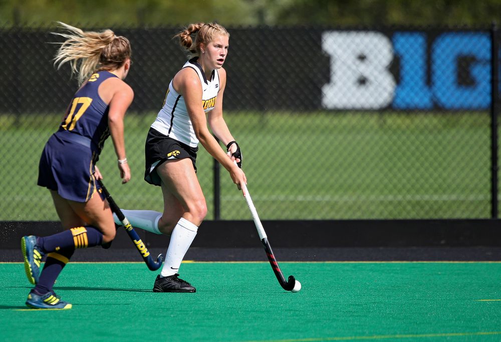 Iowa’s Lokke Stribos (14) moves with the ball during the first quarter of their game at Grant Field in Iowa City on Friday, Sep 13, 2019. (Stephen Mally/hawkeyesports.com)