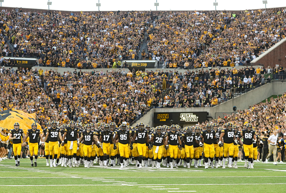 The Hawkeyes swarm as they take the field for their game at Kinnick Stadium in Iowa City on Saturday, Aug 31, 2019. (Stephen Mally/hawkeyesports.com)