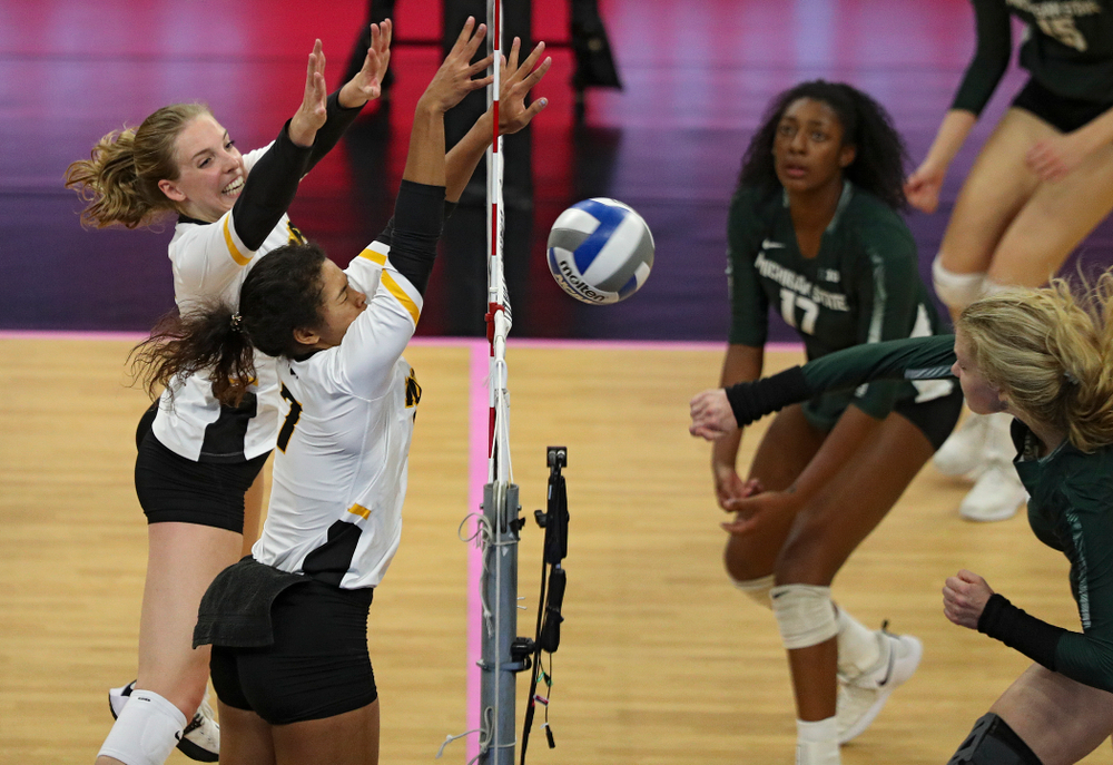 Iowa’s Hannah Clayton (18) and Iowa’s Brie Orr (7) try for the block during the third set of their volleyball match at Carver-Hawkeye Arena in Iowa City on Sunday, Oct 13, 2019. (Stephen Mally/hawkeyesports.com)
