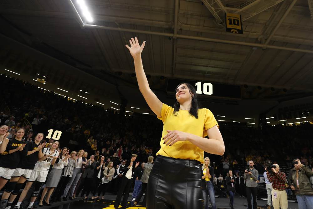 Megan Gustafson waves to the fans after her number was raised into the rafters during a jersey retirement ceremony Sunday, January 26, 2020 at Carver-Hawkeye Arena. (Brian Ray/hawkeyesports.com)