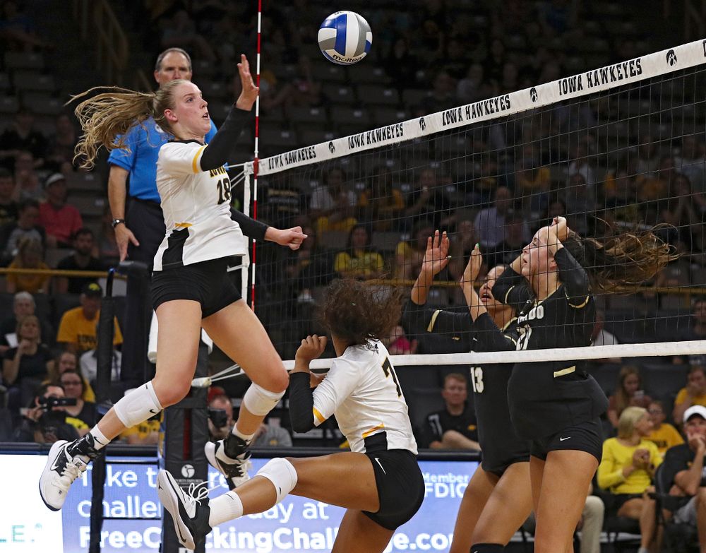 Iowa’s Hannah Clayton (18) tips the ball over the net during the third set of their Big Ten/Pac-12 Challenge match against Colorado at Carver-Hawkeye Arena in Iowa City on Friday, Sep 6, 2019. (Stephen Mally/hawkeyesports.com)