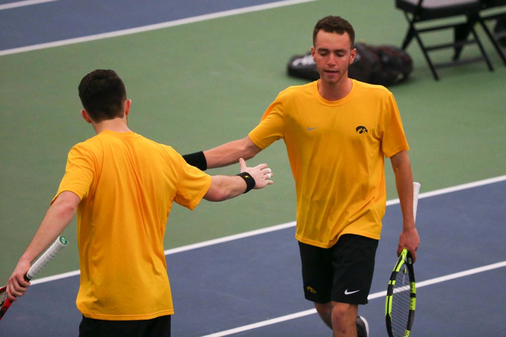 Iowa's Kareem Allaf (right) and Jonas Larsen (left) at a tennis match vs Drake Friday, March 8, 2019 at the Hawkeye Tennis and Recreation Complex. (Lily Smith/hawkeyesports.com)