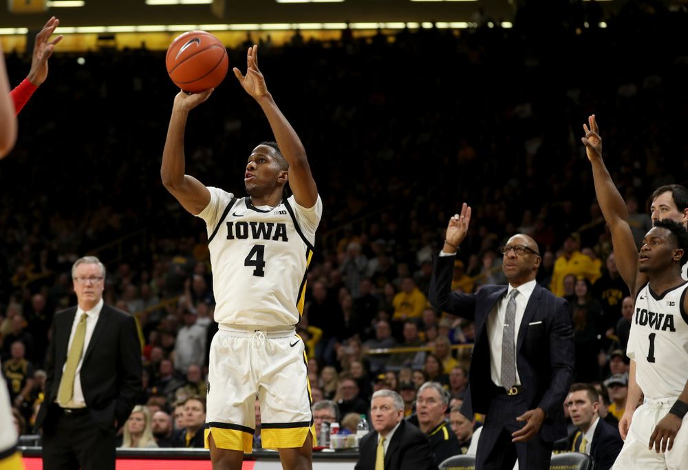 Iowa Hawkeyes guard Bakari Evelyn (4) knocks down a three point basket against the Ohio State Buckeyes Thursday, February 20, 2020 at Carver-Hawkeye Arena. (Brian Ray/hawkeyesports.com)