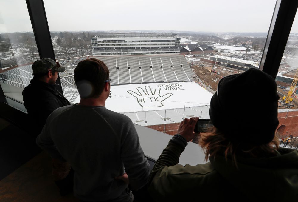 Members of the Iowa Athletics Turf Management staff create the #SnowWave for kids in the Stead Family Children's Hospital Thursday, February