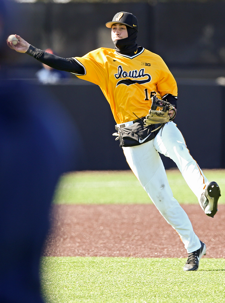 Iowa Hawkeyes shortstop Tanner Wetrich (16) throw to first for the final out in the ninth inning against Illinois at Duane Banks Field in Iowa City on Sunday, Mar. 31, 2019. (Stephen Mally/hawkeyesports.com)