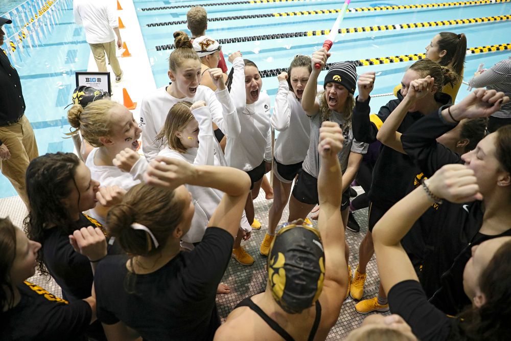 The Hawkeyes huddle during the 2020 Women’s Big Ten Swimming and Diving Championships at the Campus Recreation and Wellness Center in Iowa City on Friday, February 21, 2020. (Stephen Mally/hawkeyesports.com)