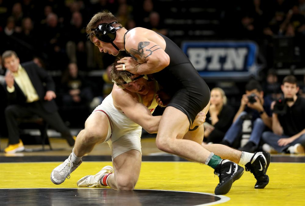 Iowa’s Cash Wilcke wrestles Ohio State’s Kollin Moore at 197 pounds Friday, January 24, 2020 at Carver-Hawkeye Arena. Moore won the match 8-3. (Brian Ray/hawkeyesports.com)